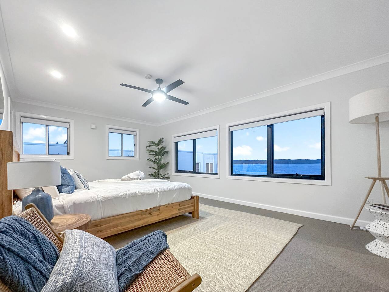 Retreat to serenity with a bedroom featuring a scenic lake view.