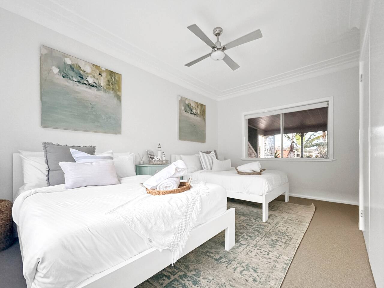 Comfortably sleep in our bedroom with two beds.