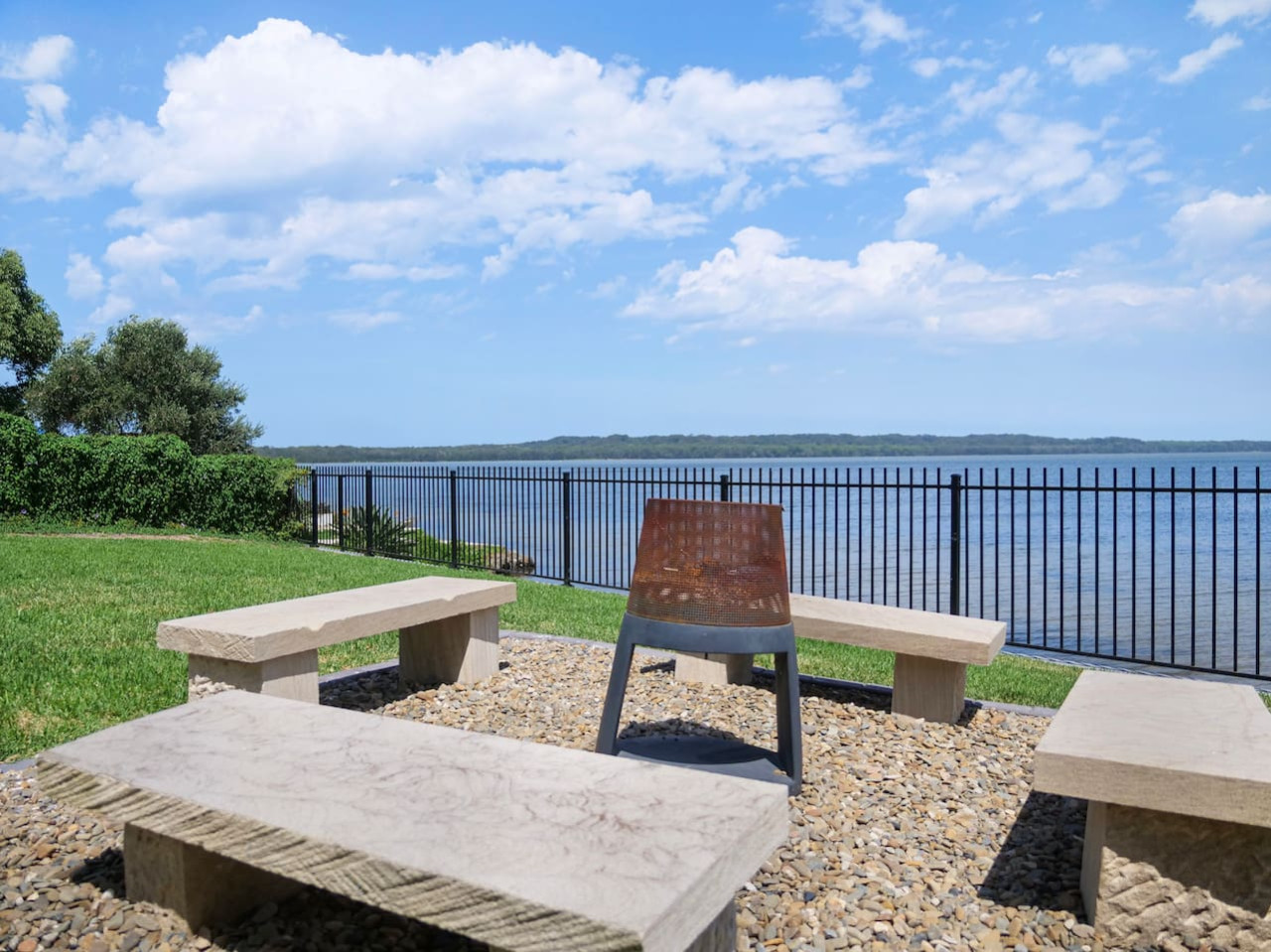 Escape to our backyard oasis with stunning lake views.