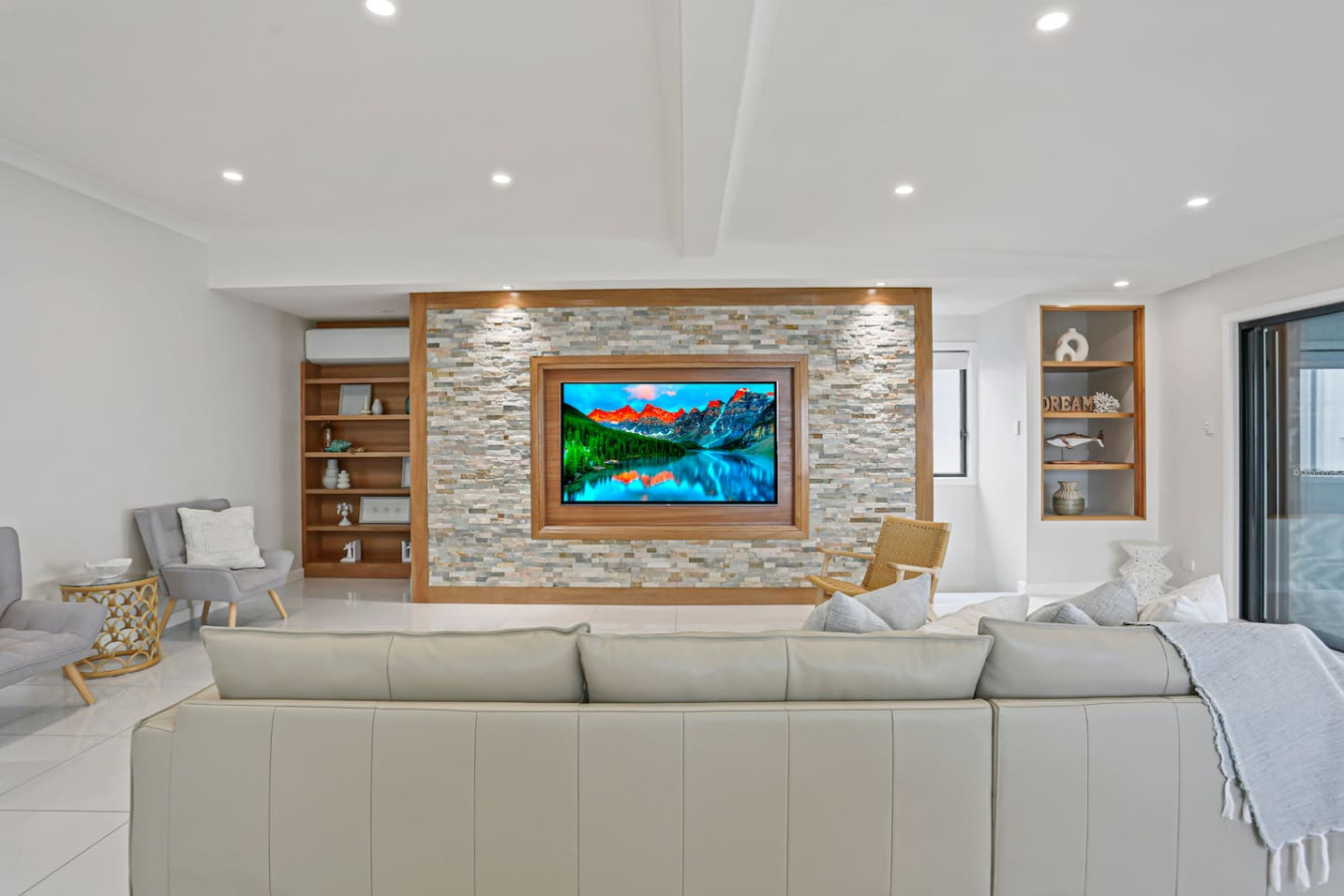 Enjoy entertainment in style with our large TV screen in the living room.