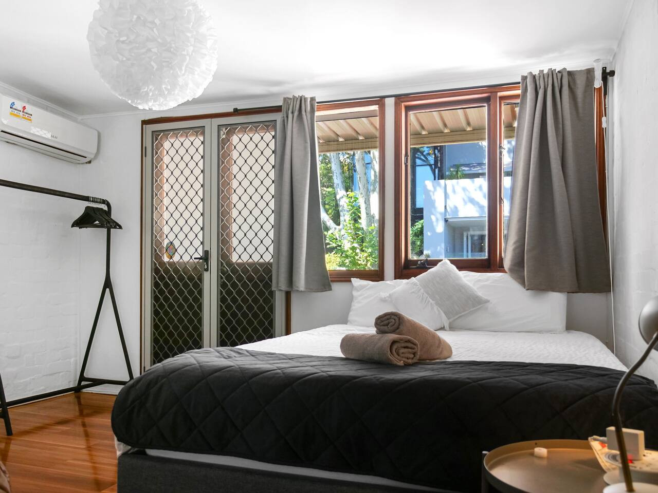 Spacious bedroom with a queen bed and stunning view.