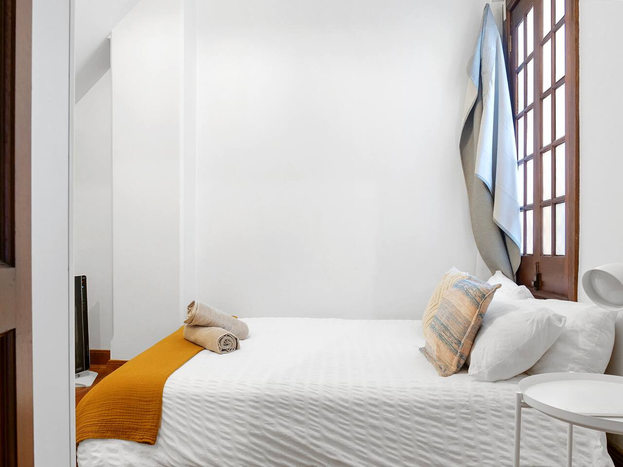 Rest easy in a bedroom with a queen bed.