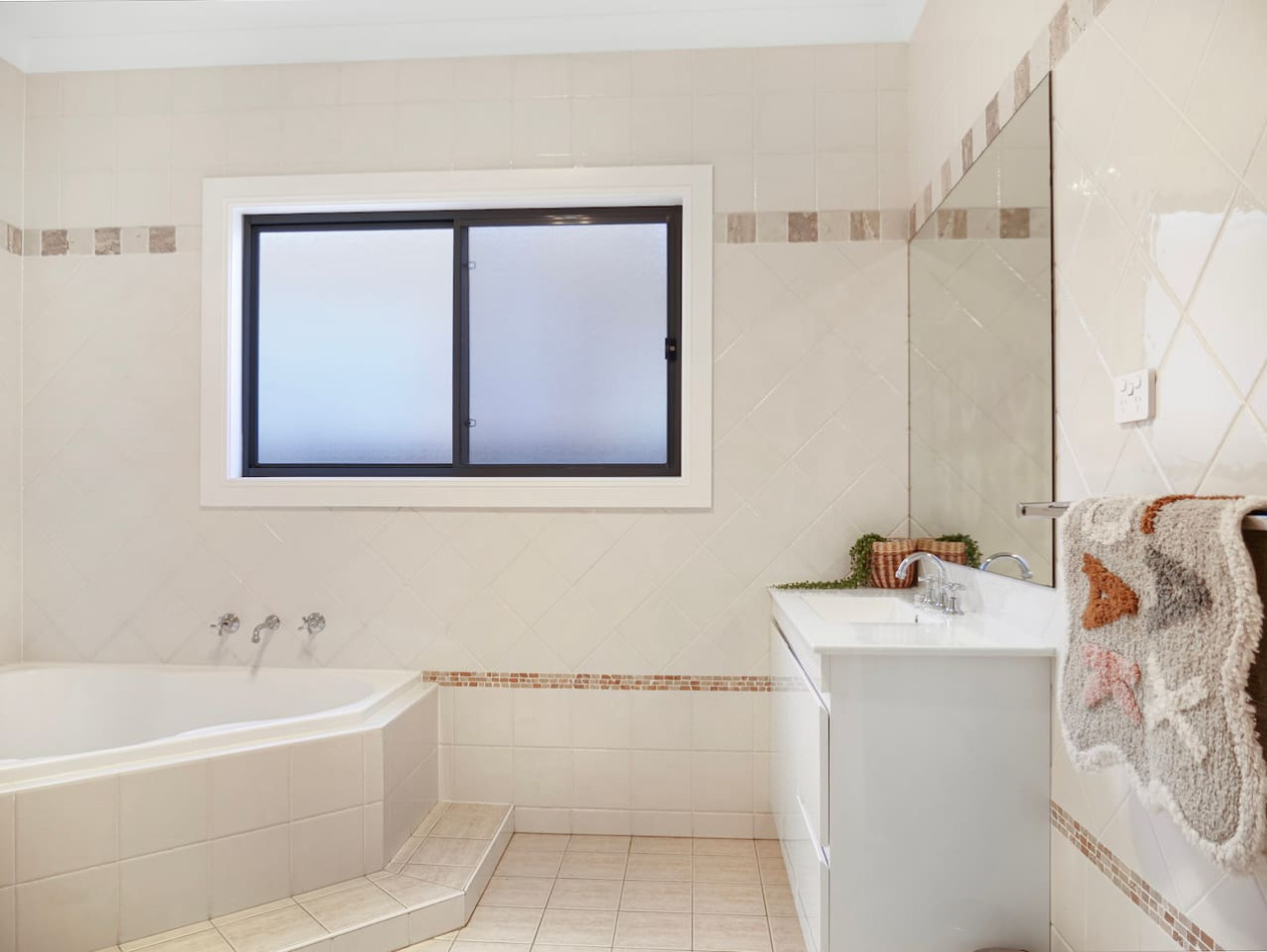 Modern bathroom with bath tub and sleek design.