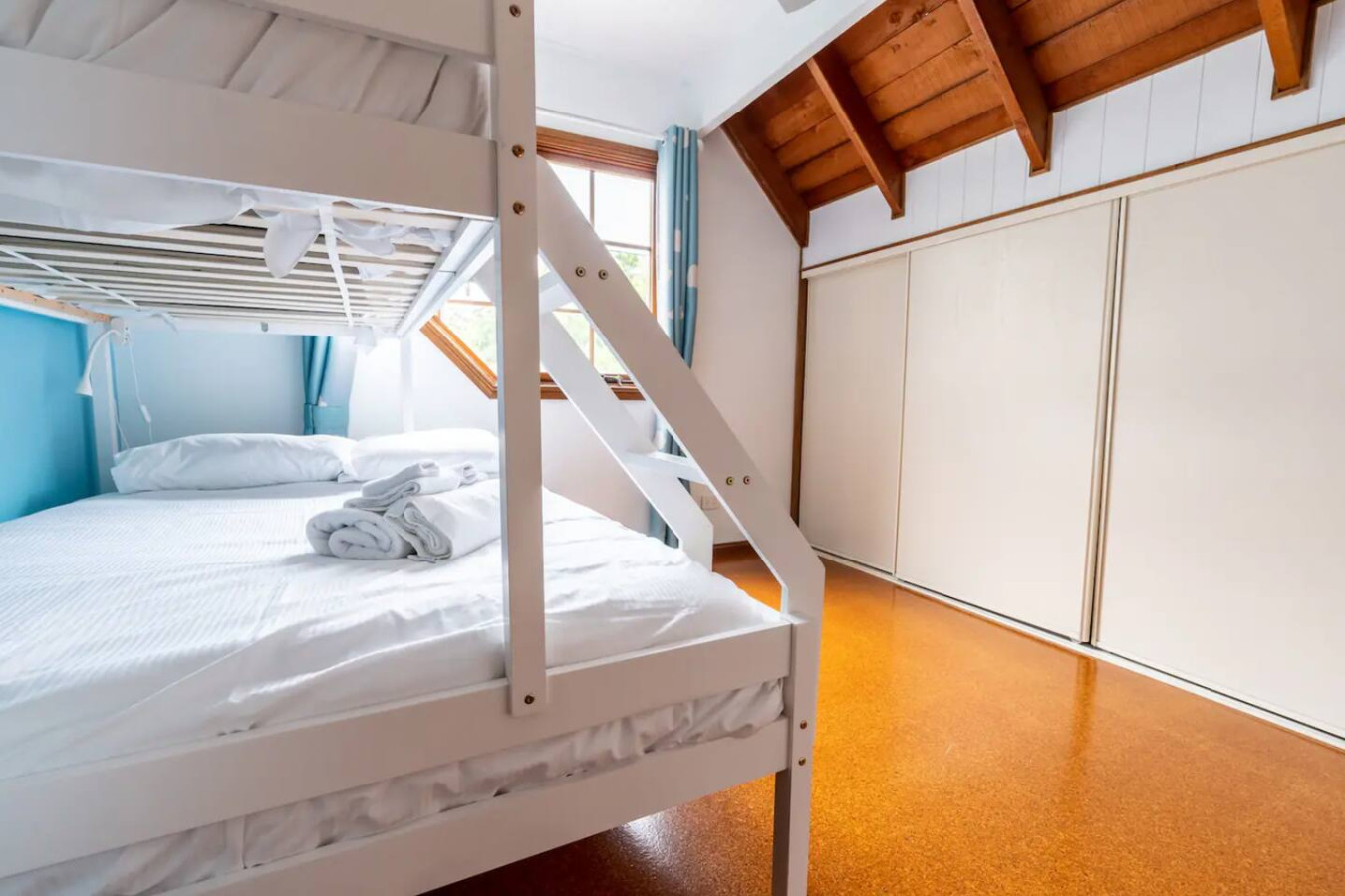 Cozy up in our bedroom with bunk beds.