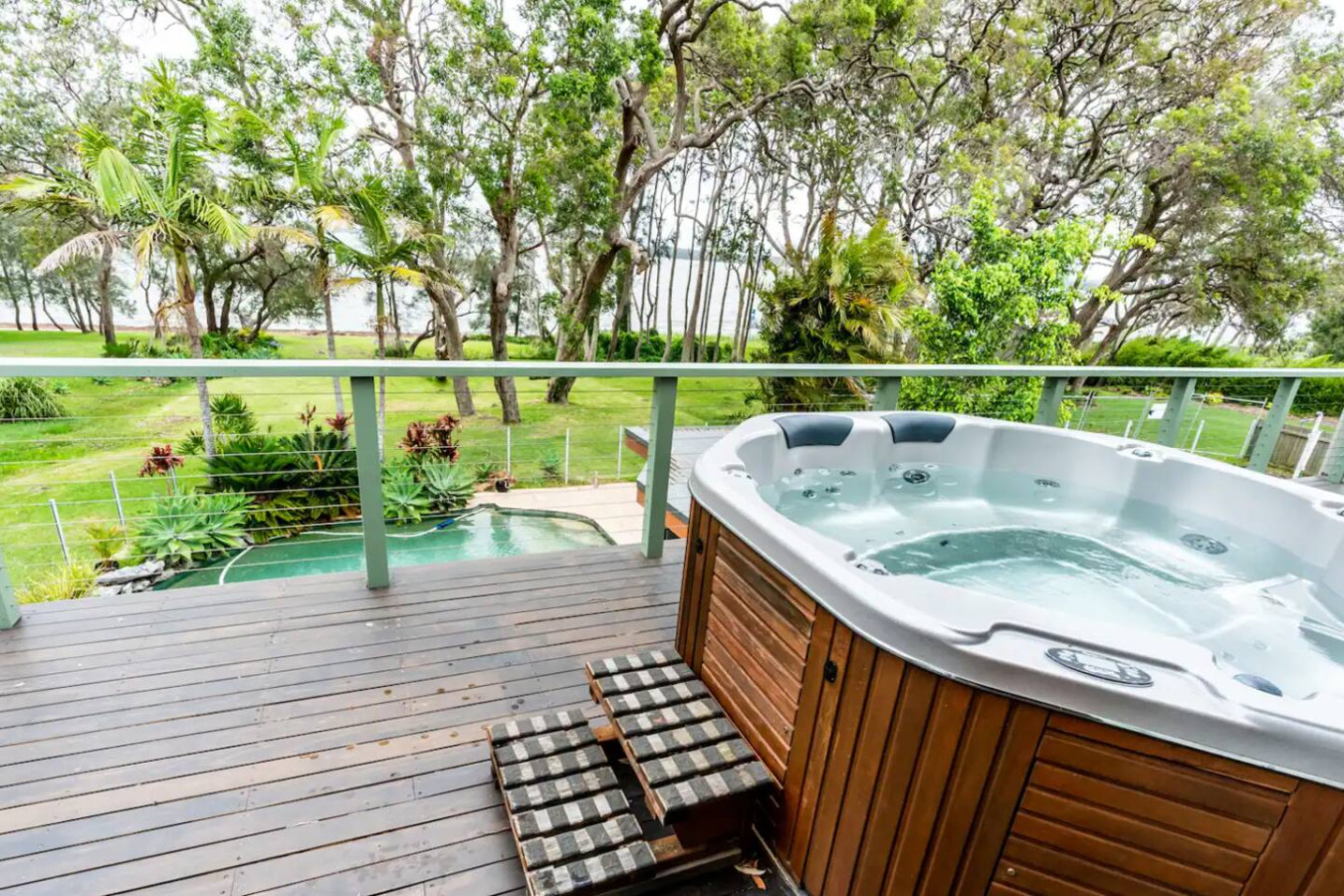 Enjoy a stunning view of the lake from the hot tub.