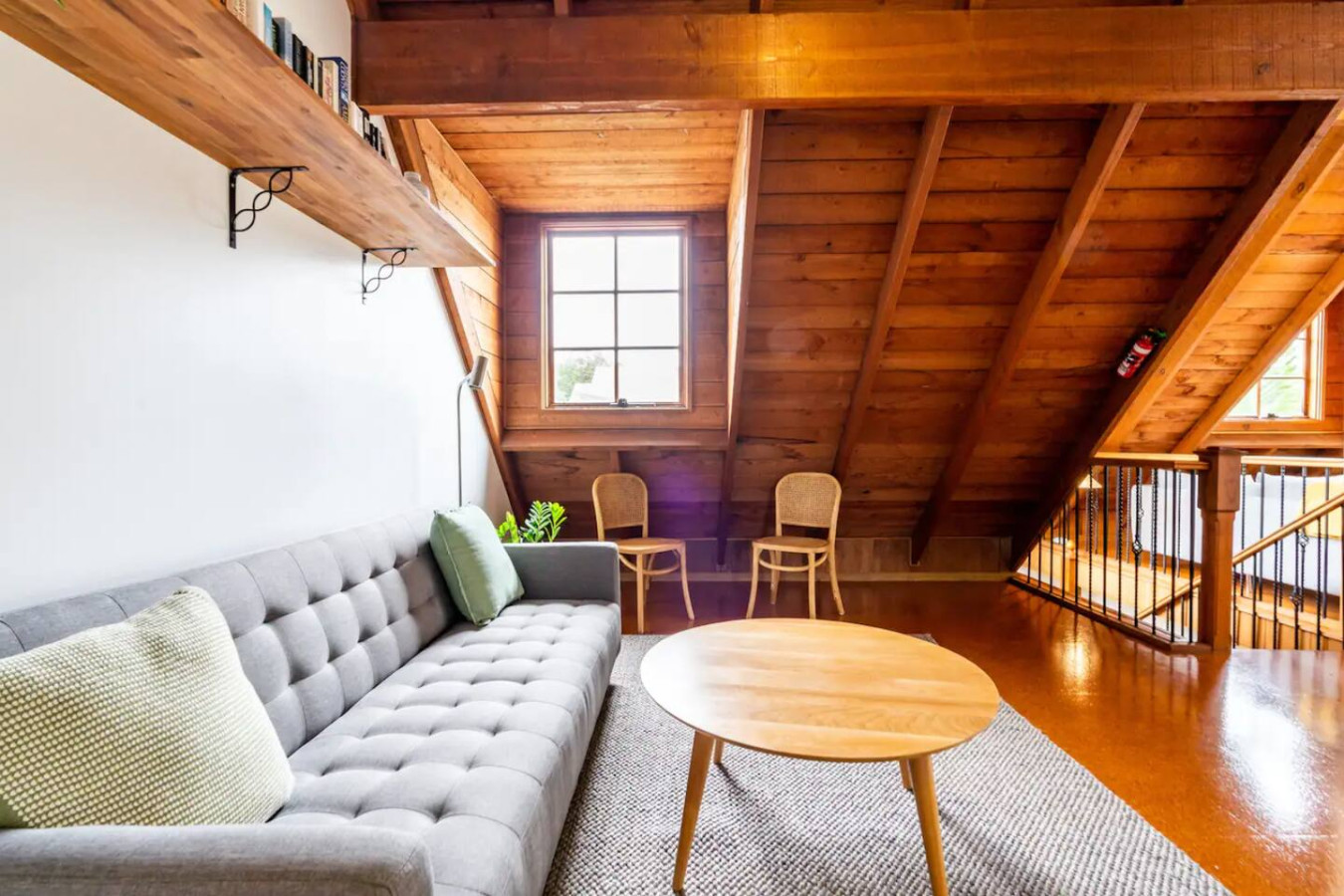 Cozy up in a living room with charming wooden features.