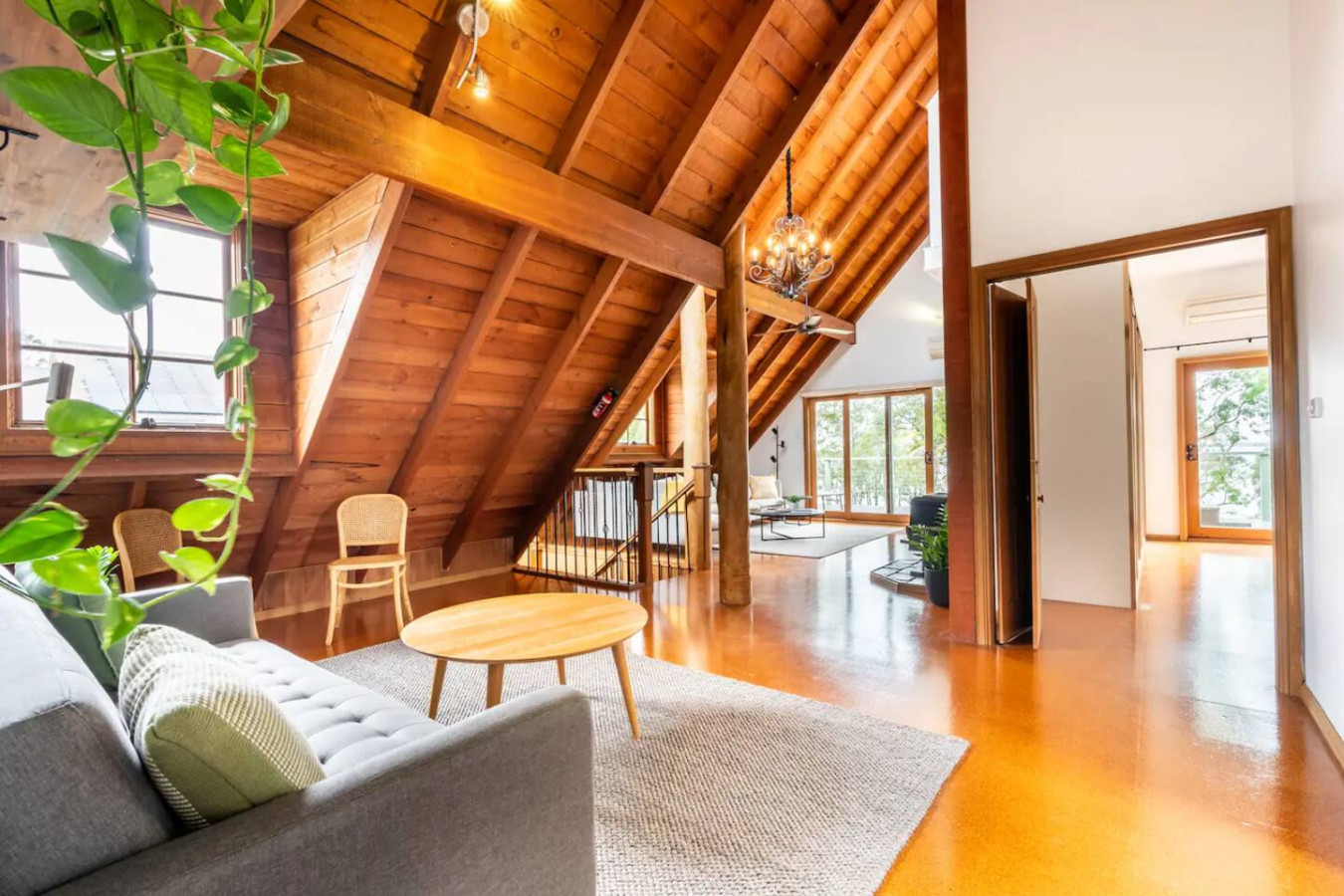 Cozy up in a living room with charming wooden features.