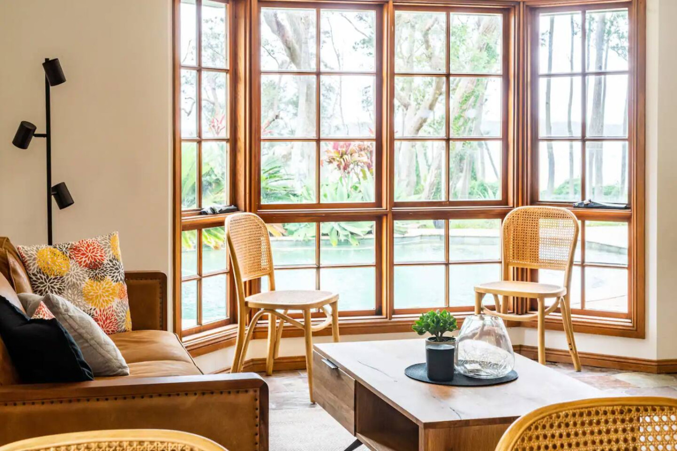 Cozy up in a living room with charming wooden features.