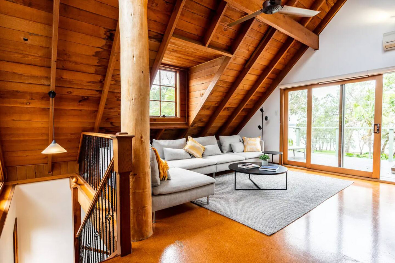 Cozy up in a living room with charming wooden features.