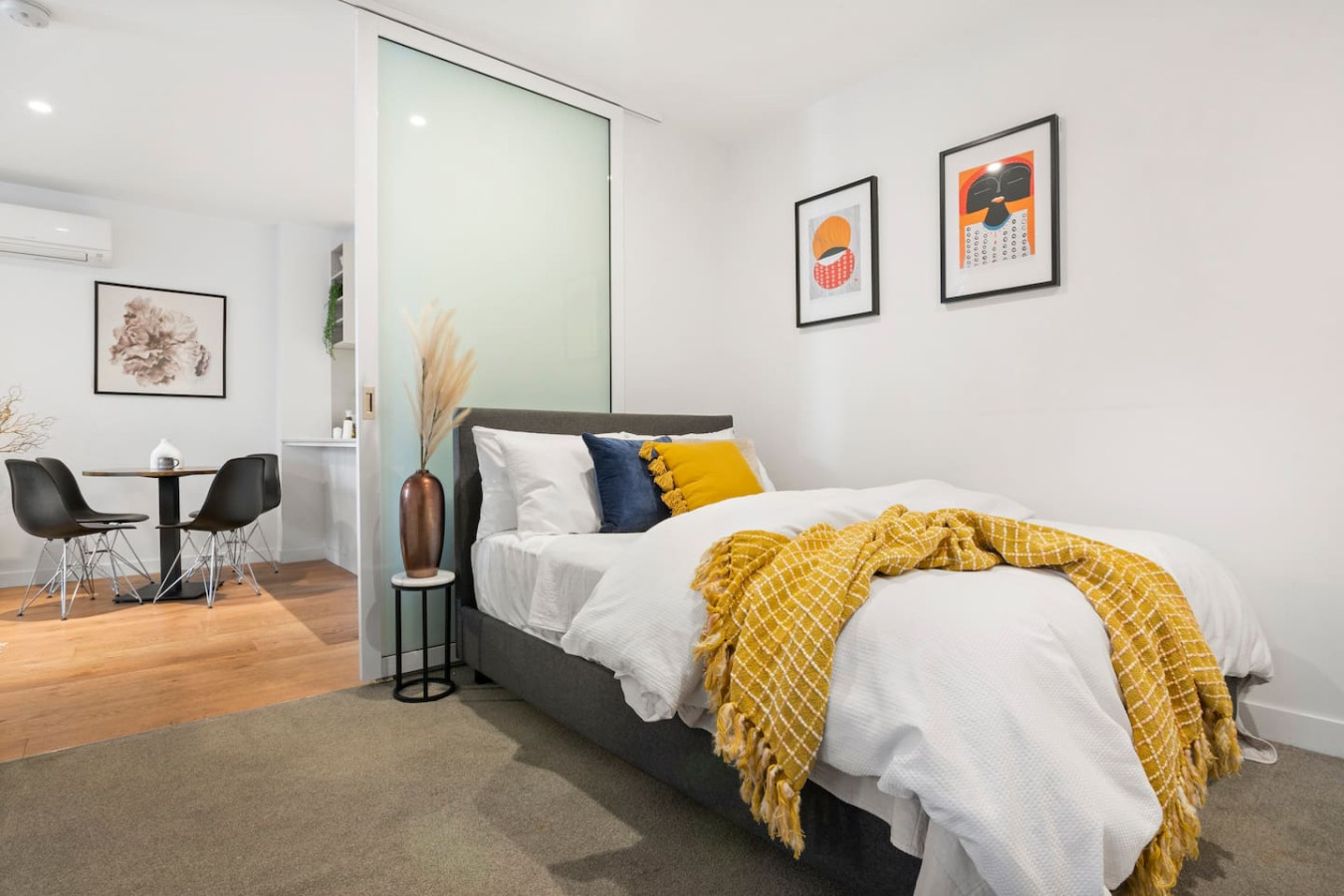 Spacious bedroom with a luxurious queen-sized bed.