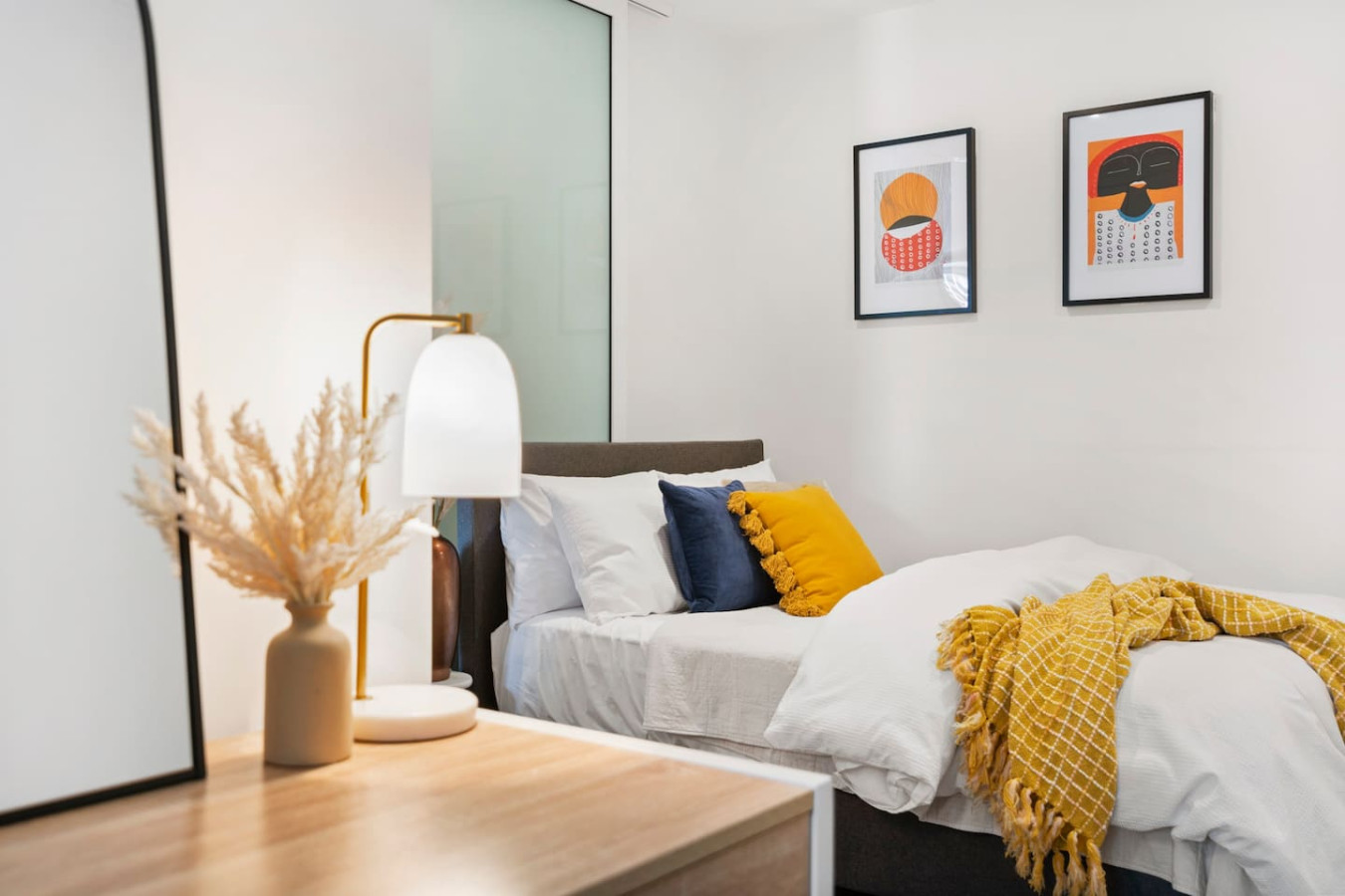 Spacious bedroom with a luxurious queen-sized bed.