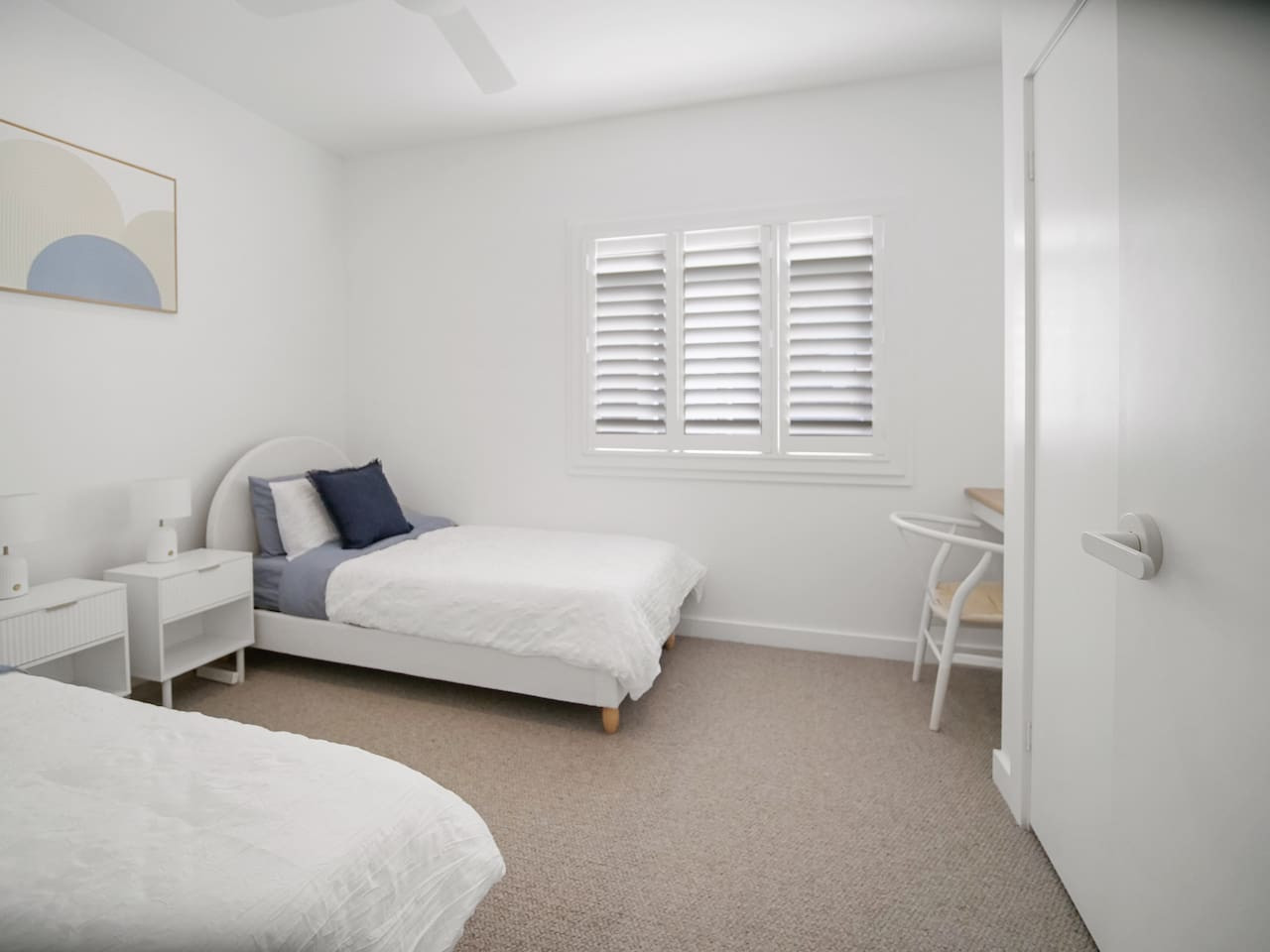 Rest comfortably in our bedroom with two single beds.
