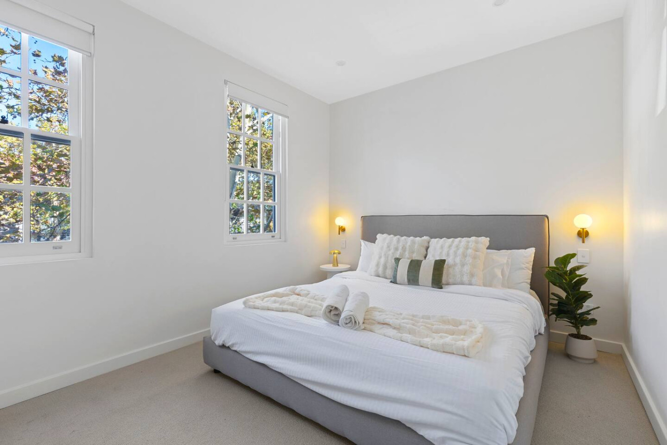 Bright and cozy retreat with a luxurious king-size bed, natural light, and stylish decor. Perfect for a relaxing stay! By Superhostly