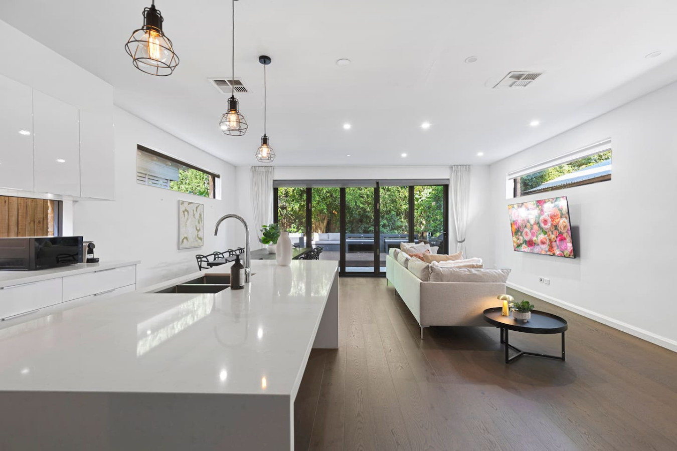 Luxury meets comfort in this open-plan living space! Enjoy a modern kitchen, stylish dining, and a cozy lounge that flows seamlessly to a private outdoor retreat. The perfect place to relax and unwind. By Superhostly