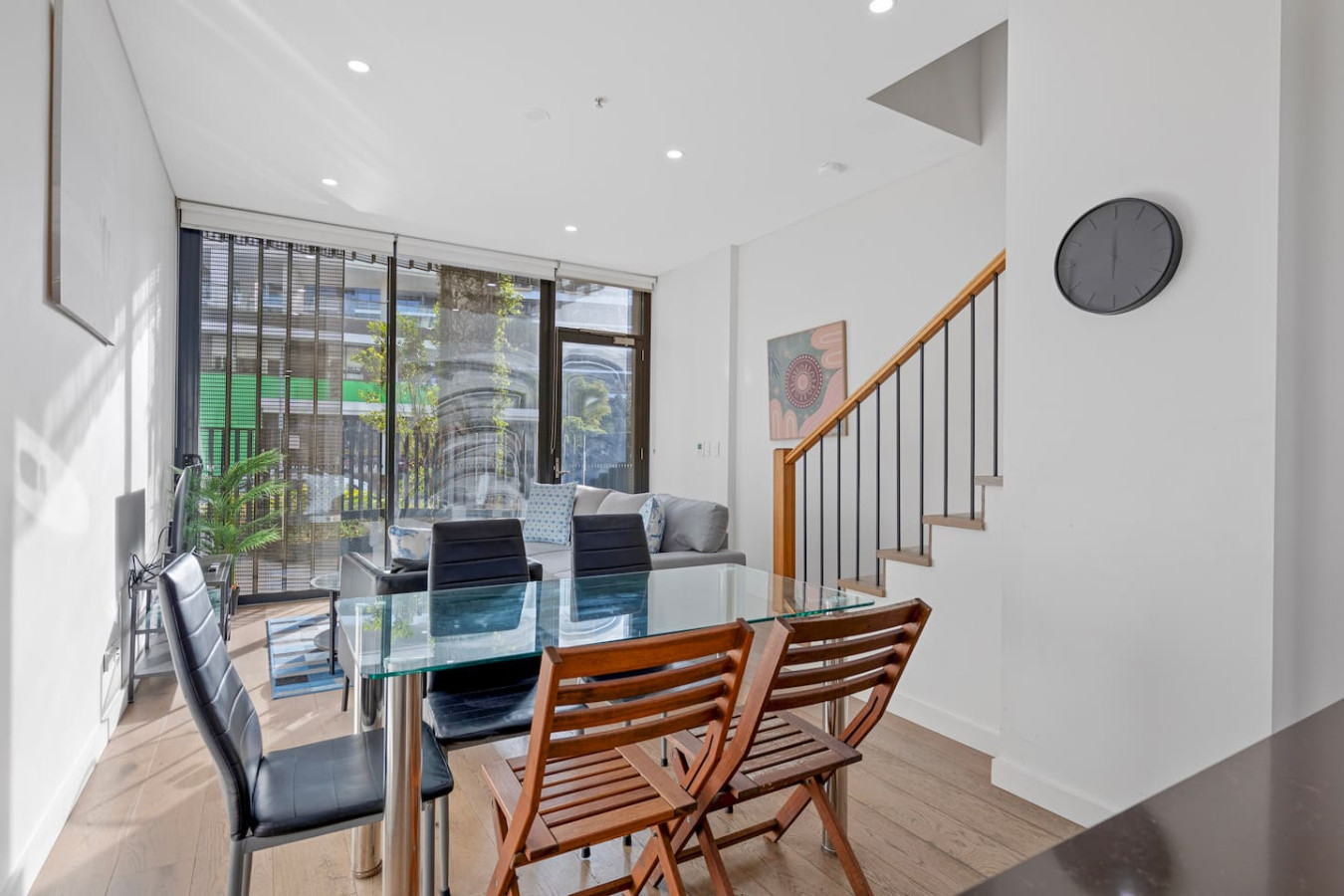 Enjoy meals in a spacious open-plan dining area that blends indoor comfort with outdoor charm. By Superhostly