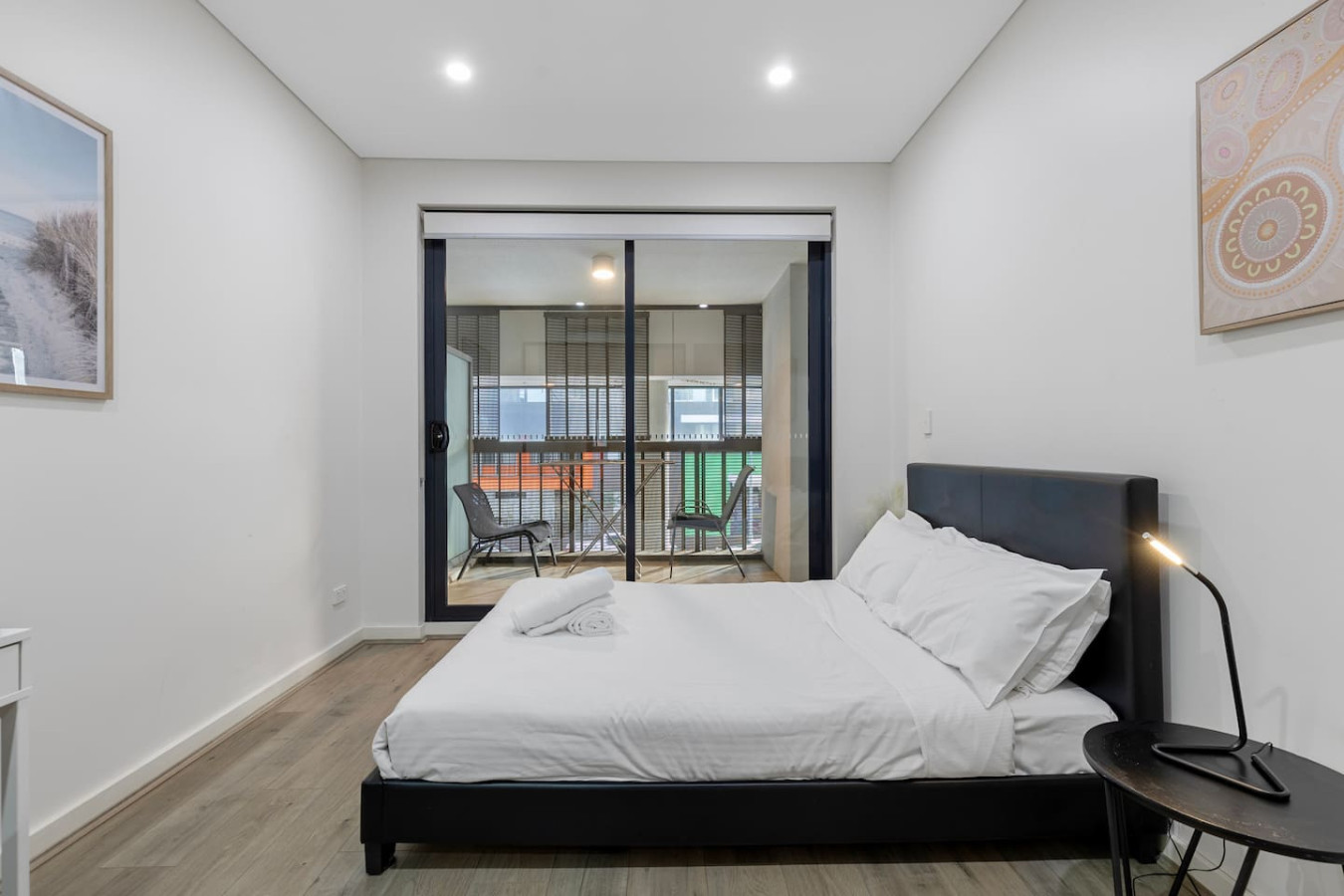 Sleep soundly in a queen bed with urban views and blackout blinds for total rest. By Superhostly