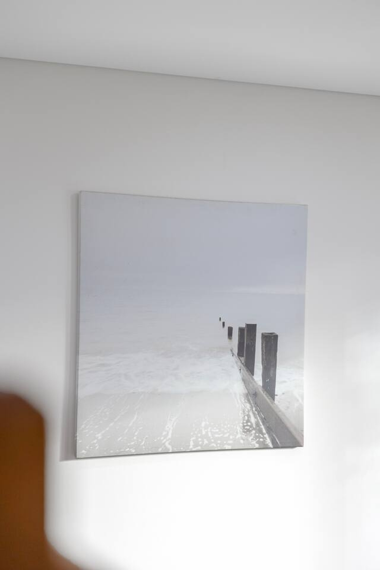 Simple wall art that adds a calming, coastal touch to the space. By Superhostly