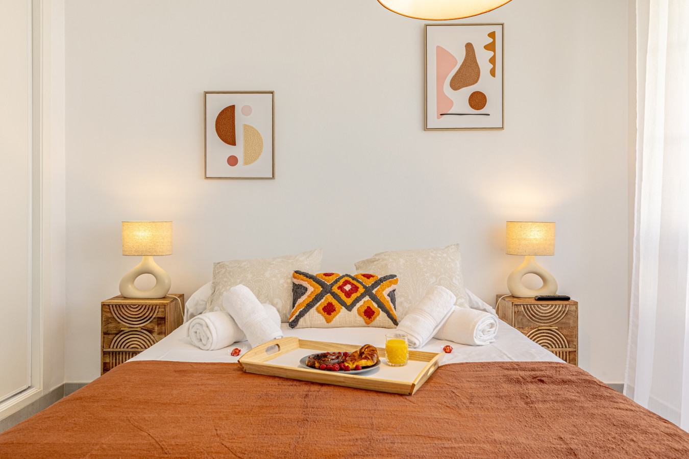 Second bedroom with double bed, TV, and pool views