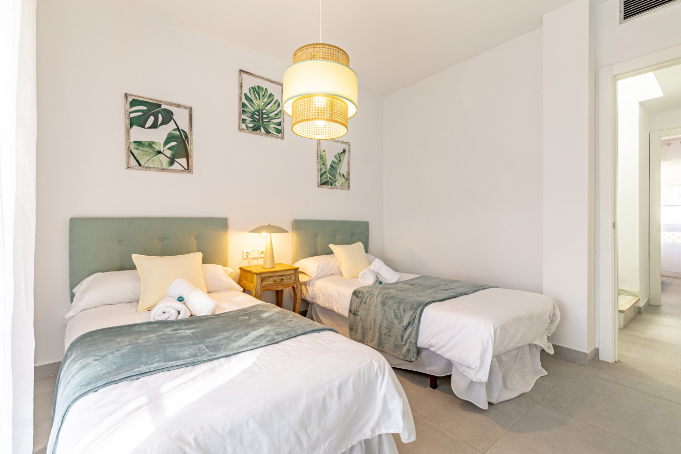 Third bedroom with twin beds and private balcony