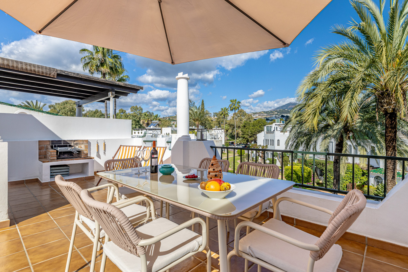 Rooftop terrace with dining area and BBQ