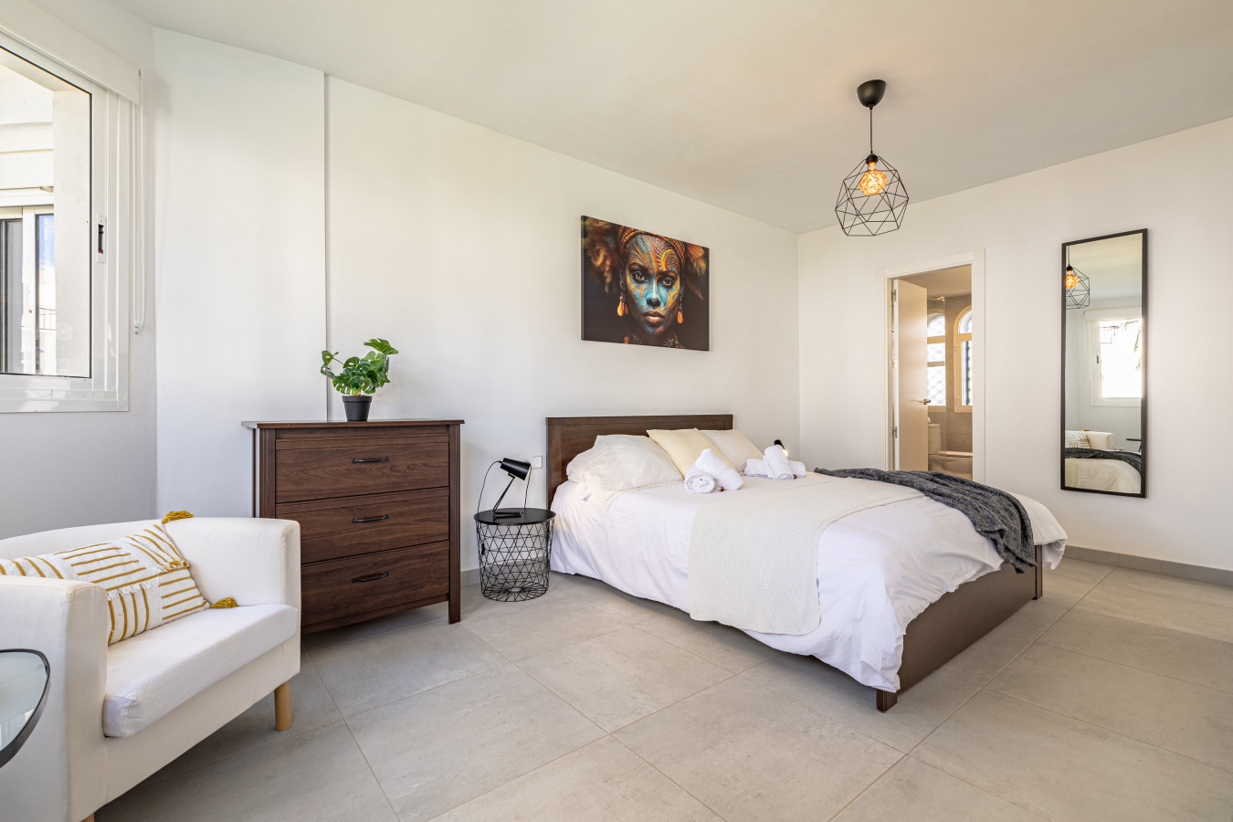 Master bedroom with king size bed and en-suite bathroom
