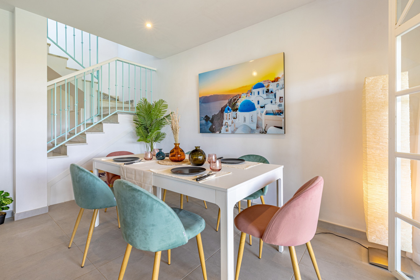 Living room 6-person dining area with glass doors leading to the terrace, pool, and gardens