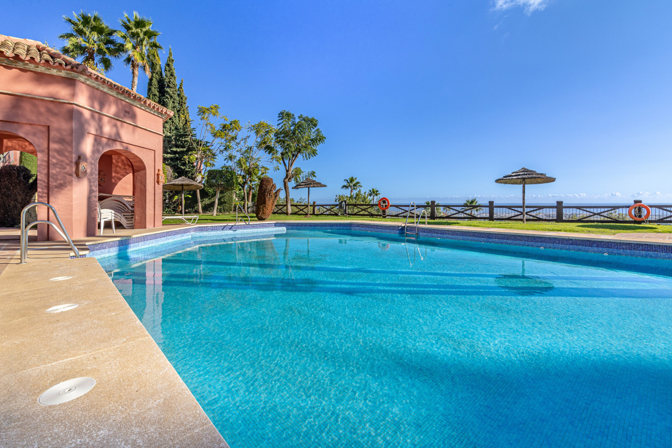 One of two large swimming pools with garden and panoramic views