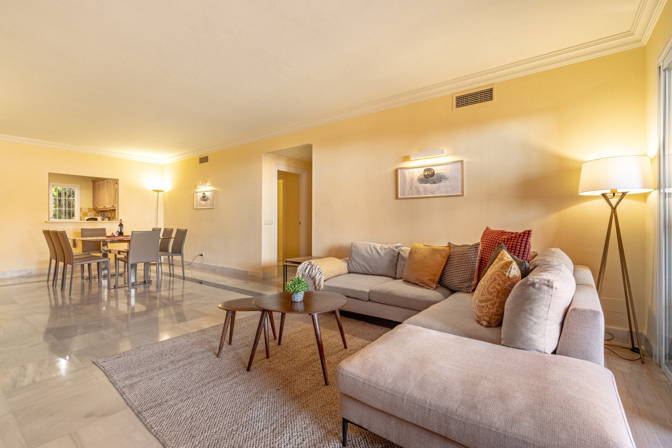 Large living room with chimney, Smart TV, seating area, dining area, French windows leading to the terrace