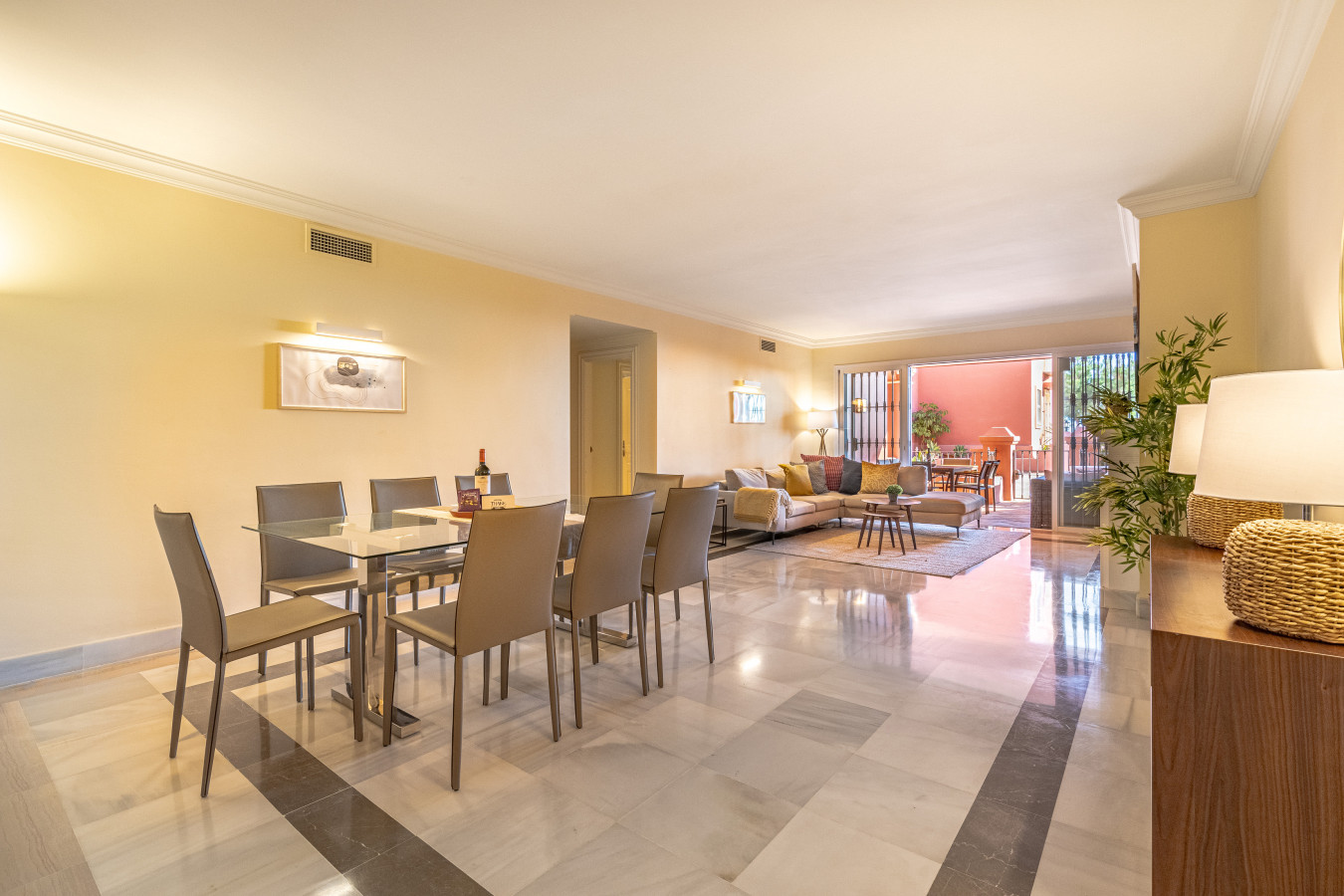 Large living room with chimney, Smart TV, seating area, dining area, French windows leading to the terrace