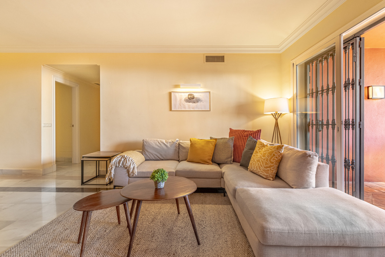 Large living room with chimney, Smart TV, seating area, dining area, French windows leading to the terrace