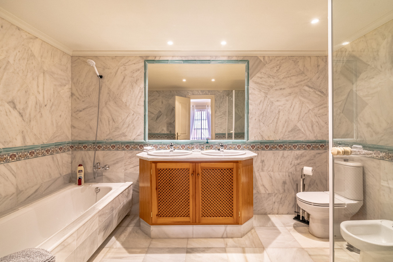 Master bedroom en-suite bathroom with walk-in shower and shower over bath