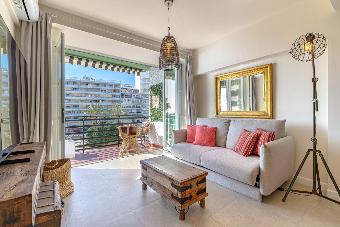 Sofa and coffee table facing the open terrace doors