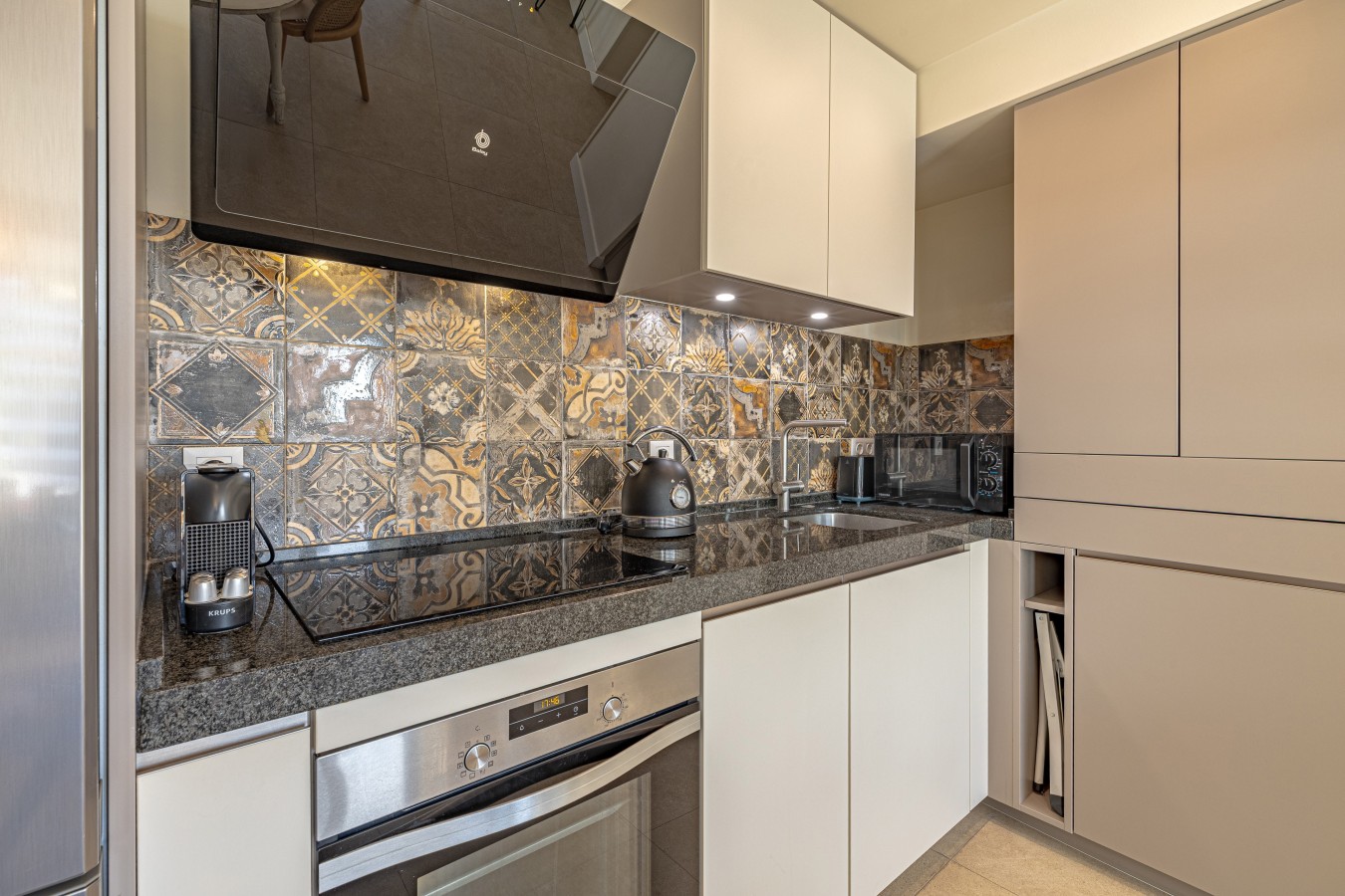 Nespresso machine, kettle and microwave on the granite worktop