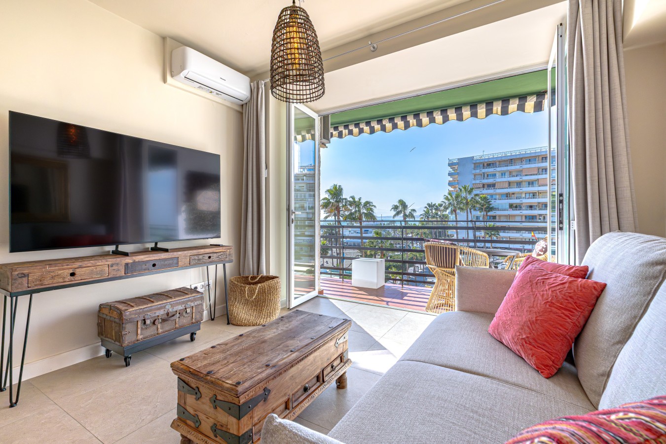 Living room with bi-fold windows opening onto the terrace