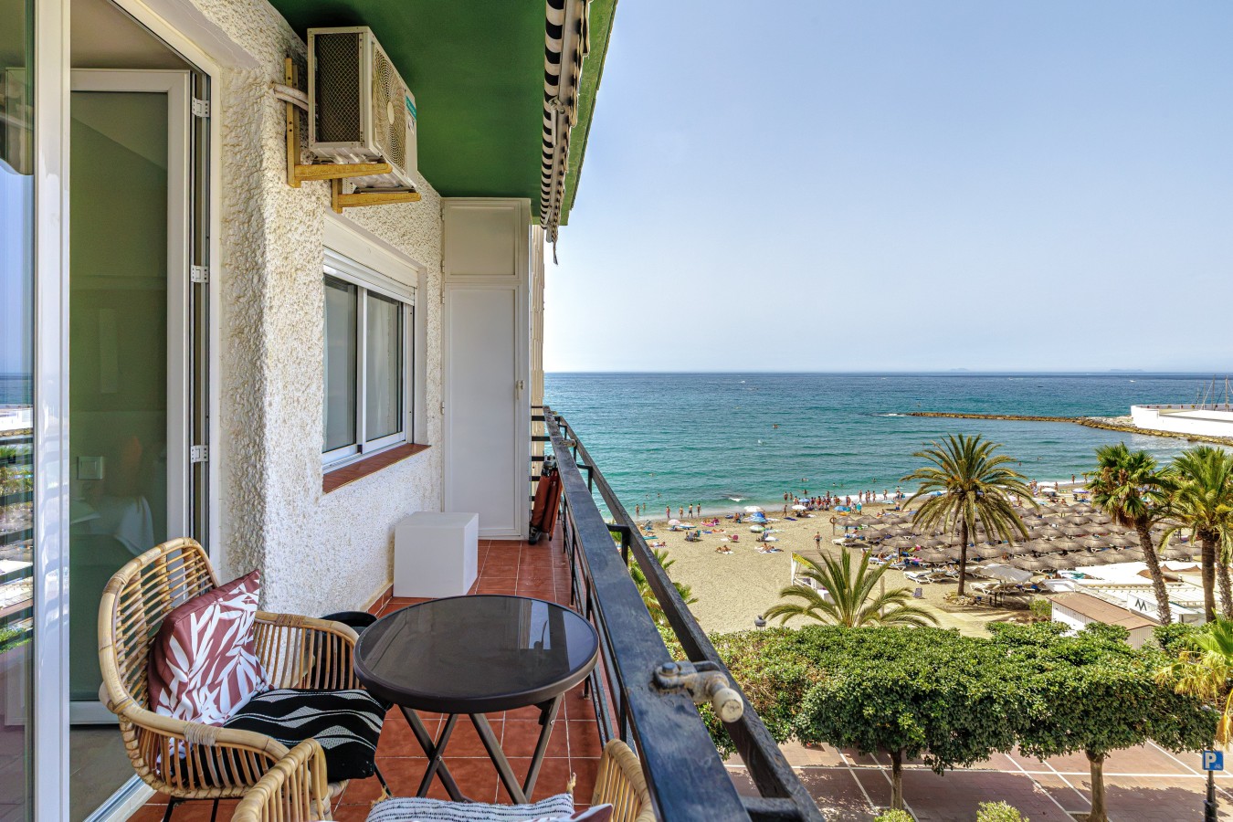 Terrace seating directly above Marbella's beach