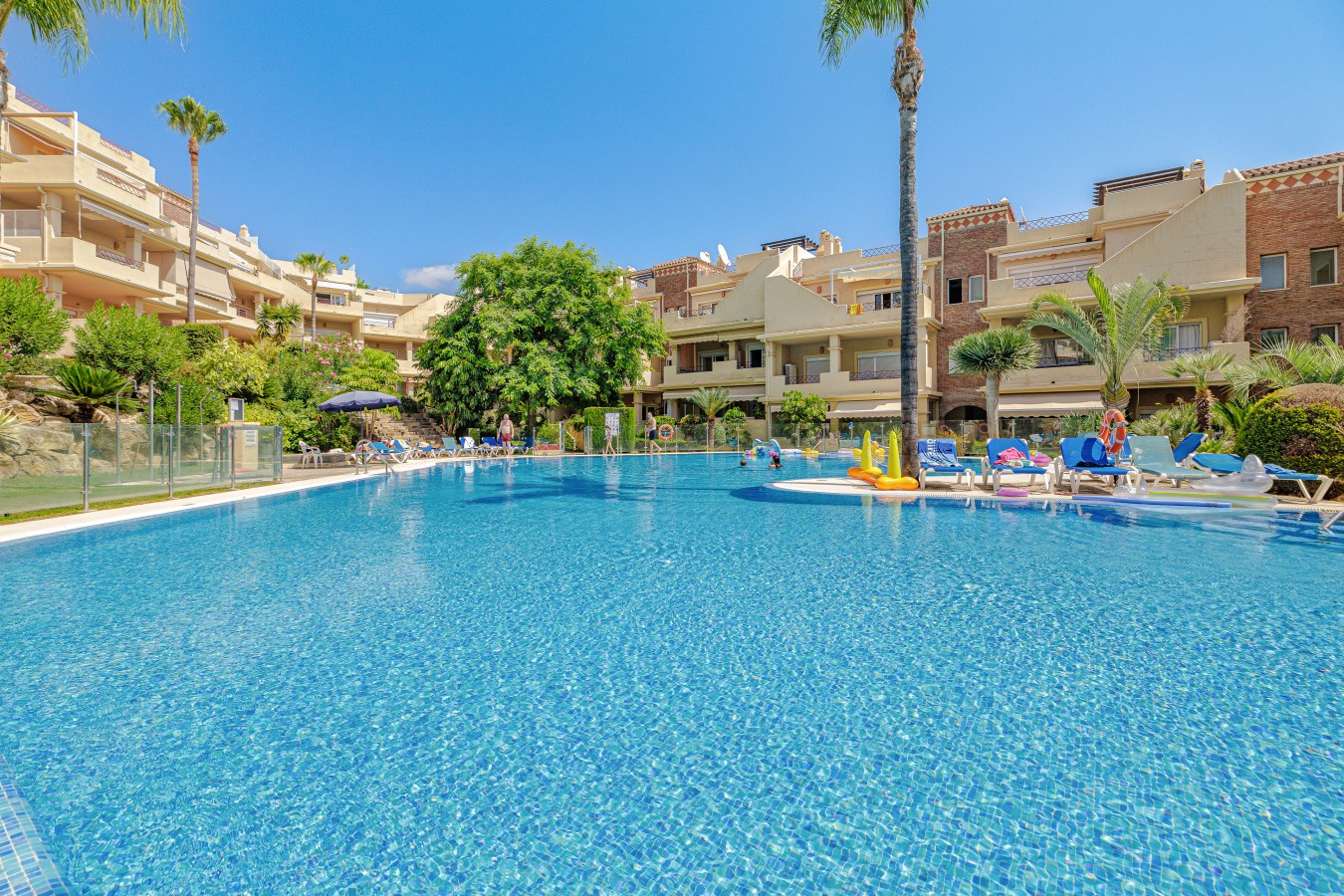 Communal swimming pool set in the gardens, open seasonally