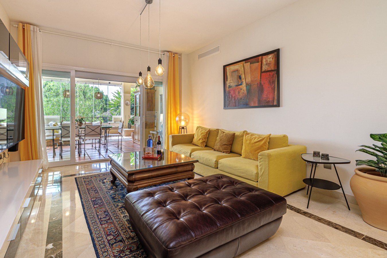 Living room opening onto the enclosed terrace