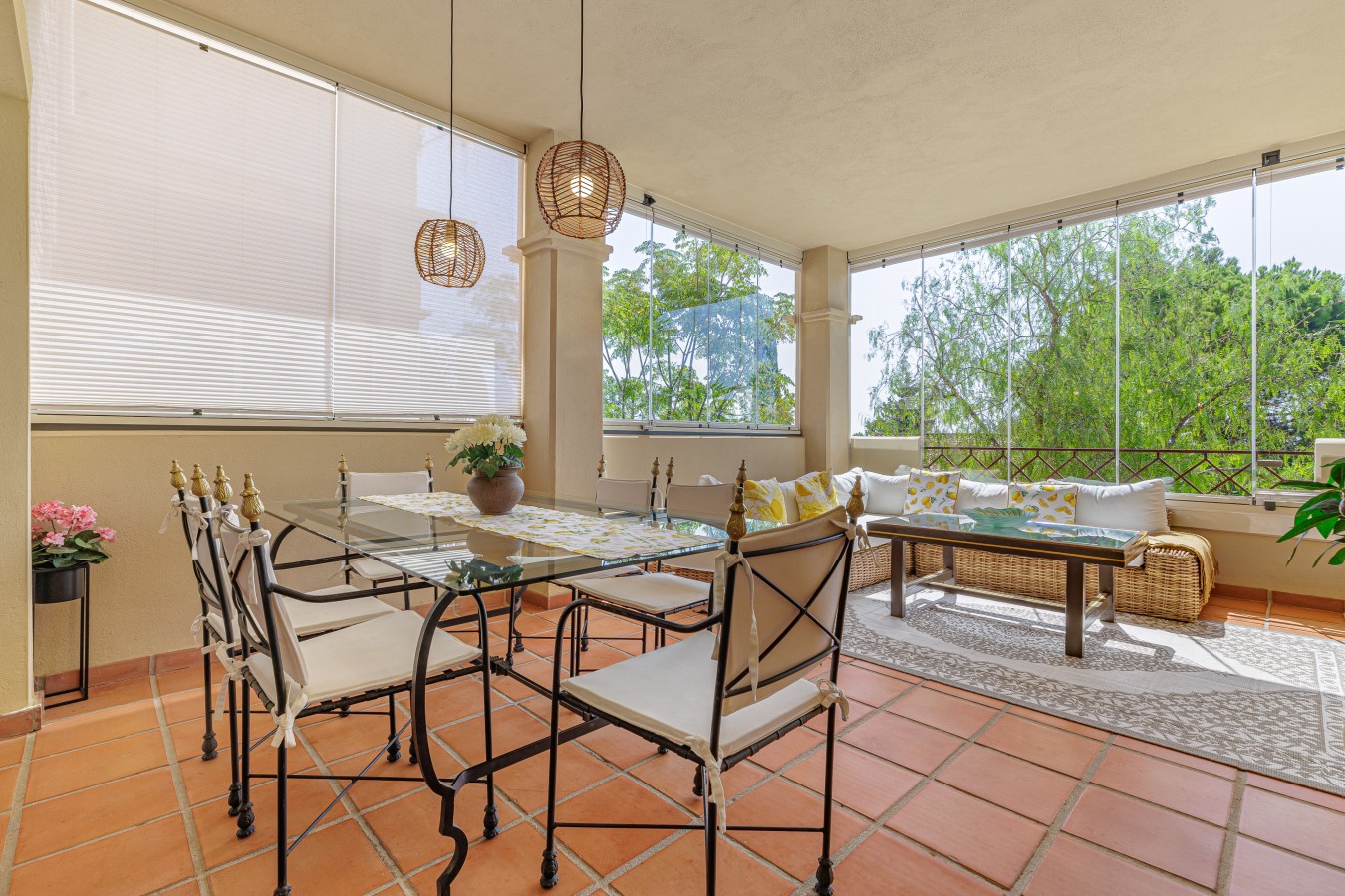 Terrace dining table seating six, behind Lumon glazing