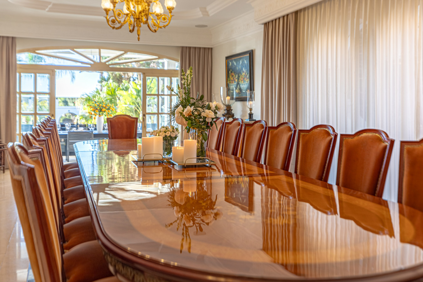 Spacious 16-person dining room connecting the kitchen to the terrace