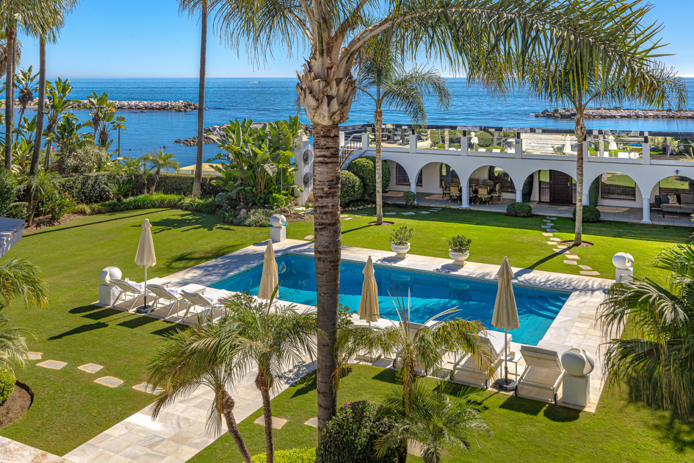Picasso pool and garden with open sea views