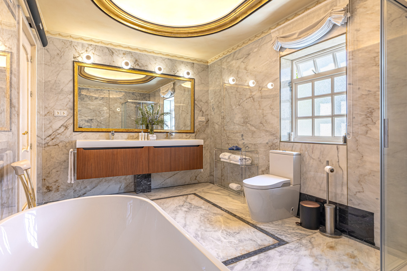 Second bedroom en-suite bathroom with bath and shower