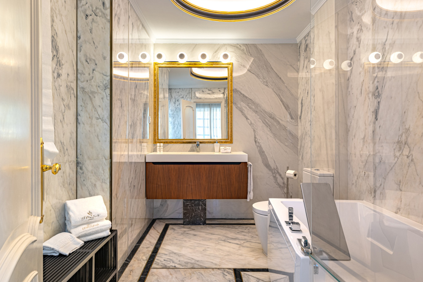 Third bedroom en-suite bathroom with shower over bath