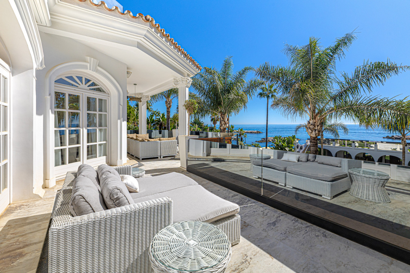 Second bedroom terrace with sea, pool, and garden views