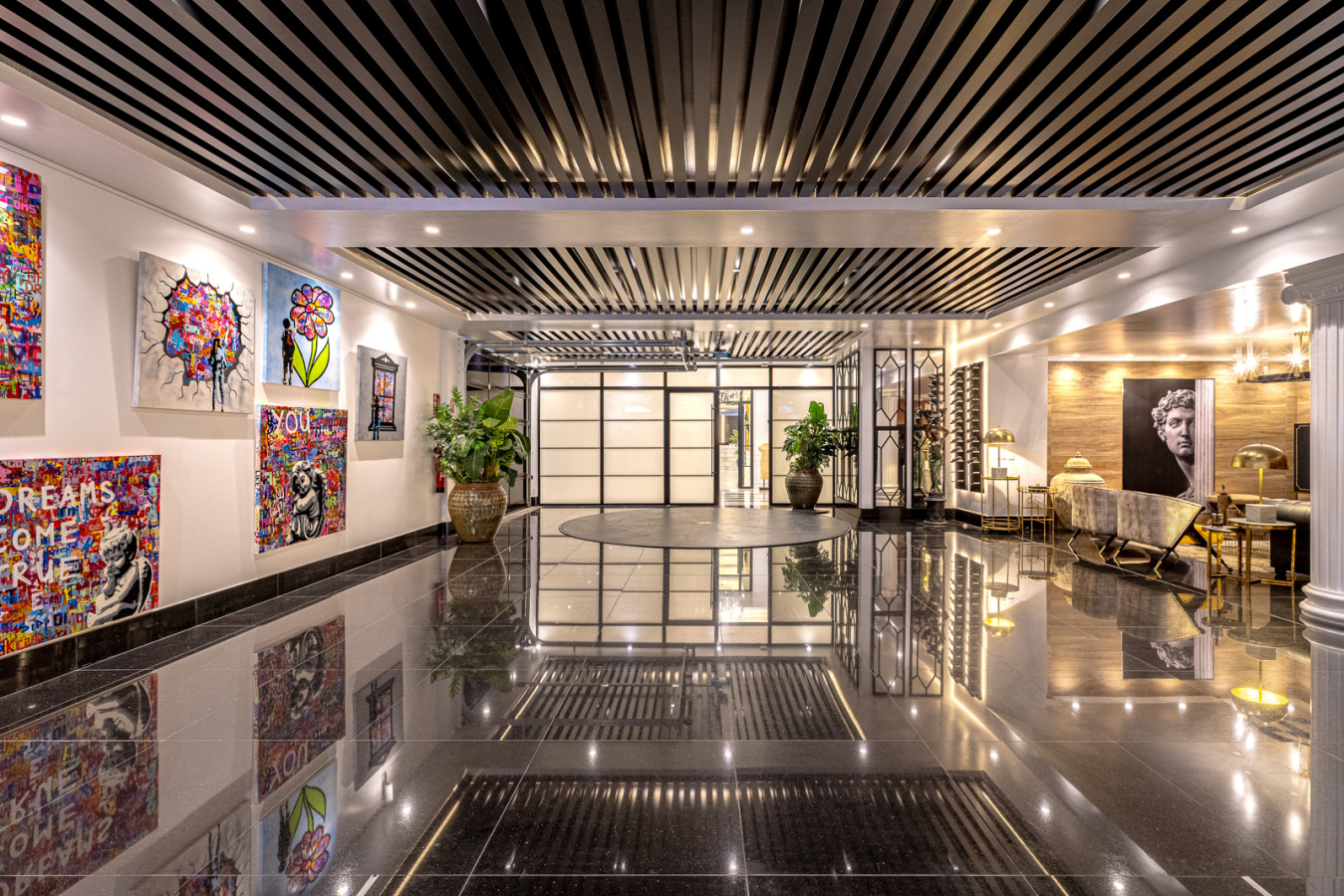 Spacious garage with artwork and chillout area