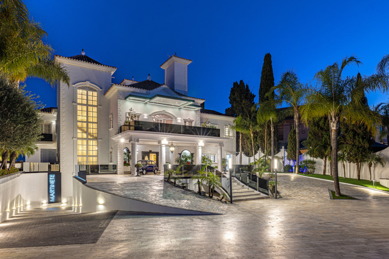 Villa El Martinete lit up facade and marble driveway