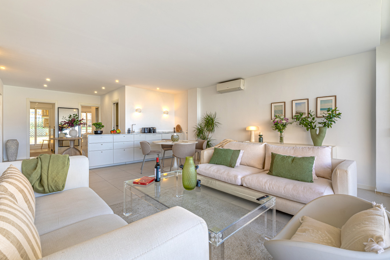 Living room, central seating area, dining area, and kitchen