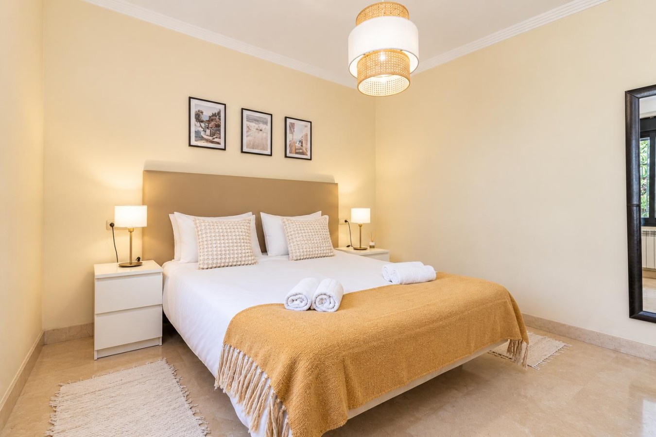 Second bedroom with TV and bedside lighting