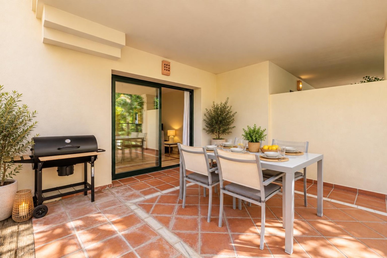 Terrace dining table for six with the BBQ alongside