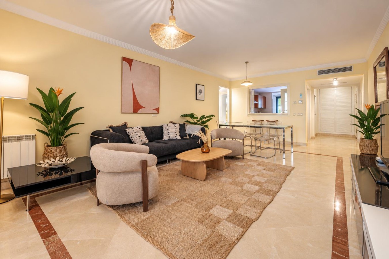 Open plan living and dining area, with the terrace doors at one end
