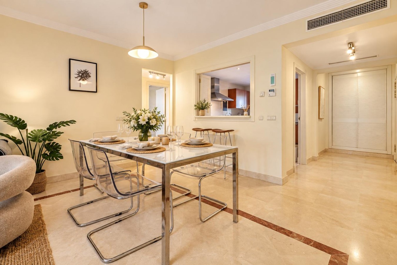 Indoor dining table alongside the kitchen serving hatch